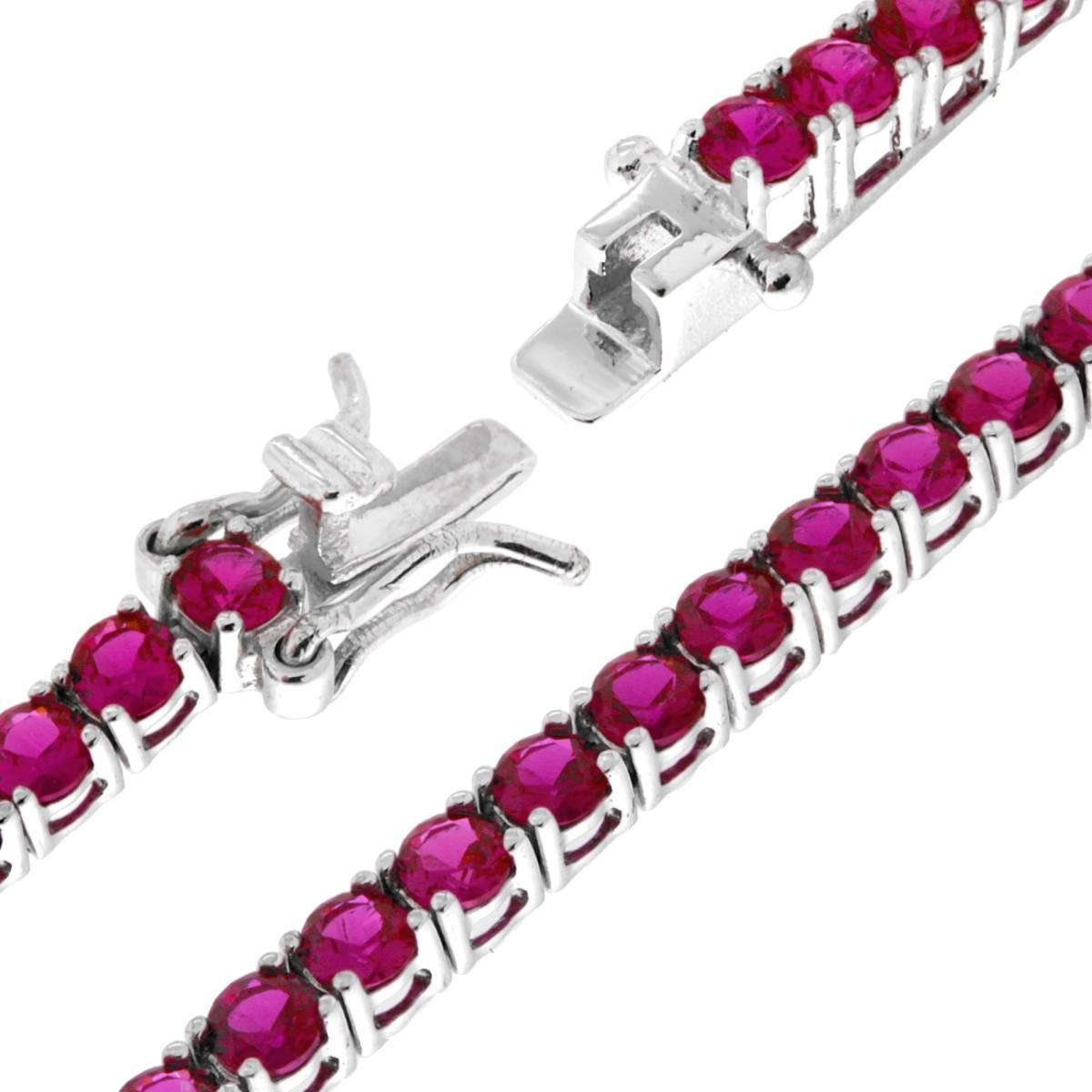 Bracciale a riviera in oro bianco con rubini rosa, con chiusura a scomparsa.