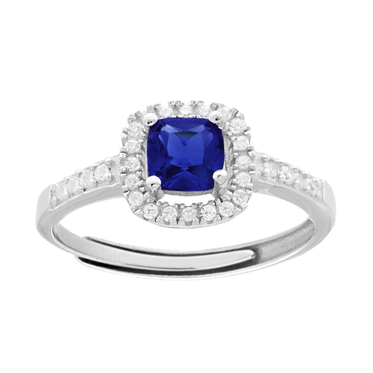 Anello in argento con zaffiro blu taglio cuscino e contorno di zirconi bianchi.