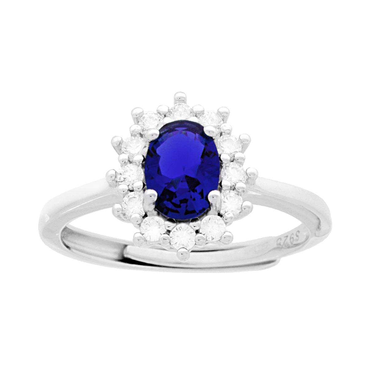 Anello in argento con zaffiro ovale circondato da diamanti.
