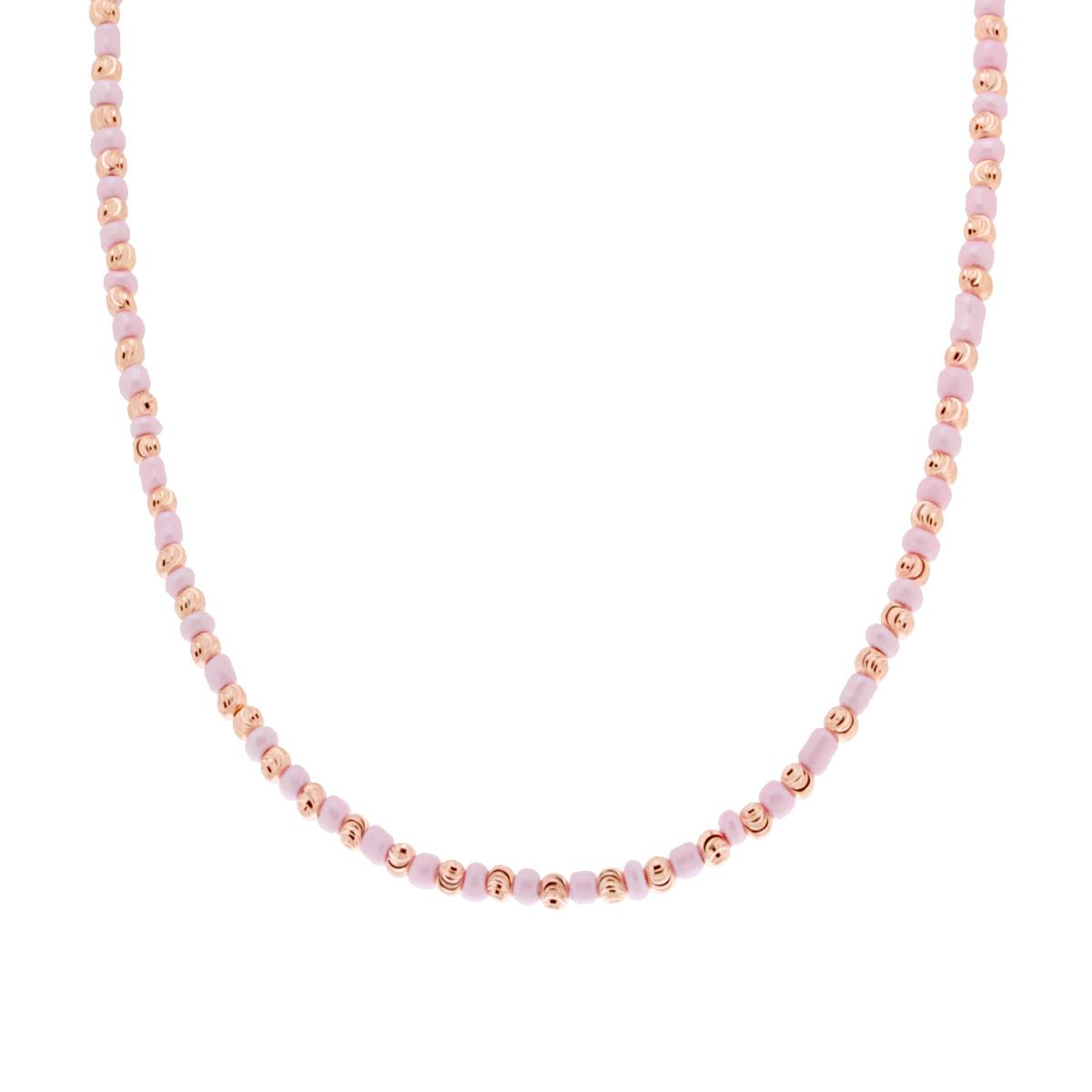 Collana girocollo con perle rosa e perline dorate a forma di faccina sorridente.