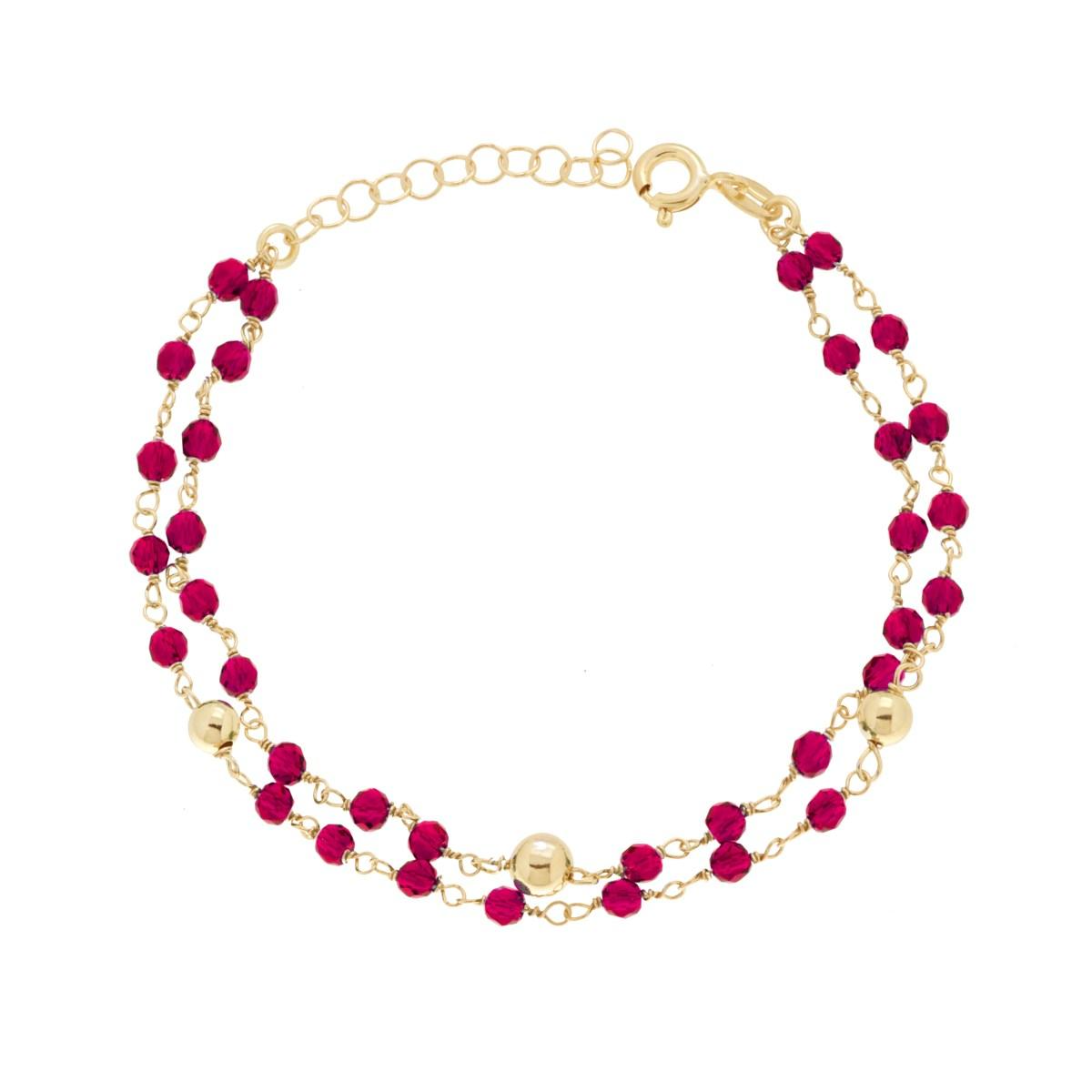 Bracciale a doppio filo con perline rosse e sfere dorate, chiusura ad anello.