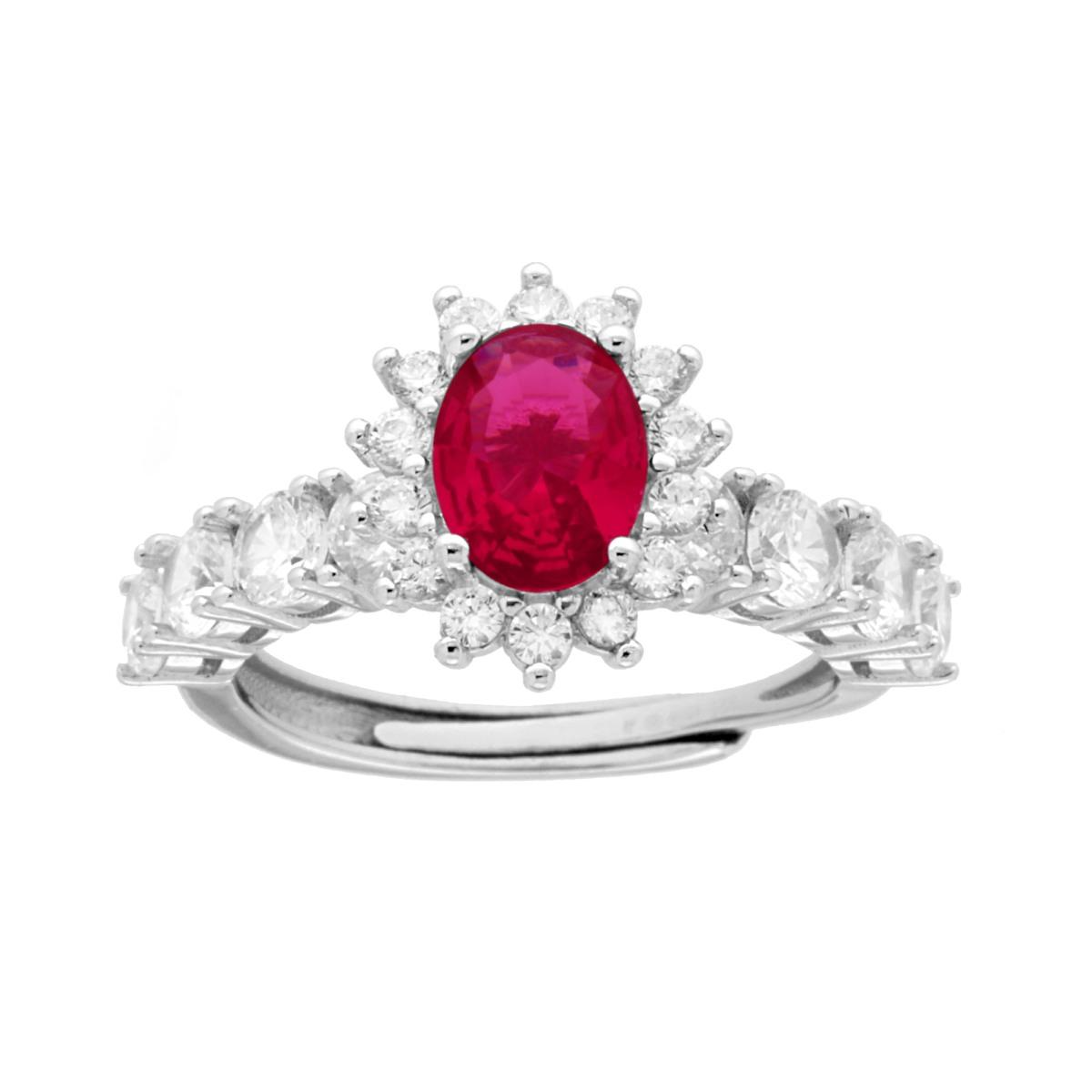 Anello in argento con rubino centrale ovale e cornice di diamanti.