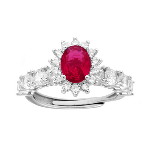 Anello in argento con rubino centrale ovale e cornice di diamanti.