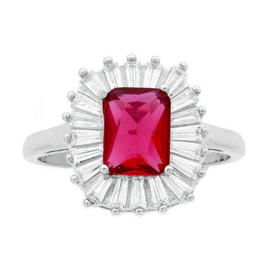 Anello in argento con rubino rettangolare contornato da zirconi a taglio baguette.