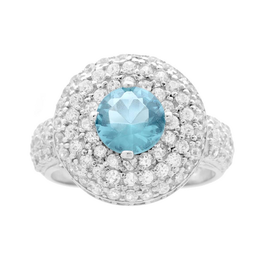 Anello in oro bianco con grande gemma centrale azzurra e diamanti bianchi incastonati a pavé.