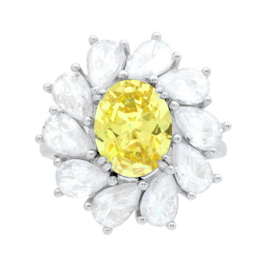 Anello in argento con pietra ovale gialla centrale circondata da zirconi a goccia.