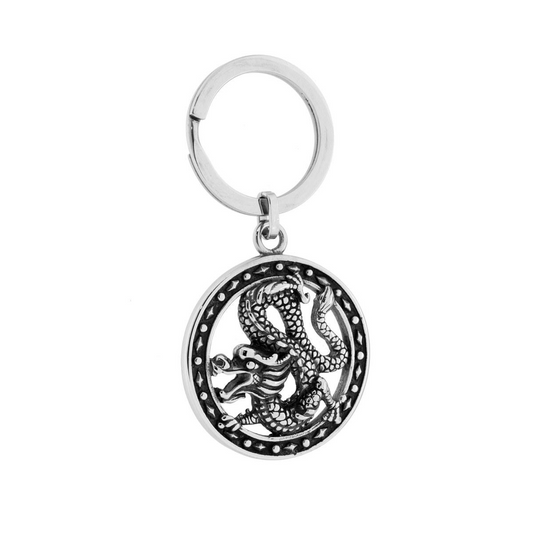 Portachiavi in metallo con medaglione raffigurante un drago stilizzato.