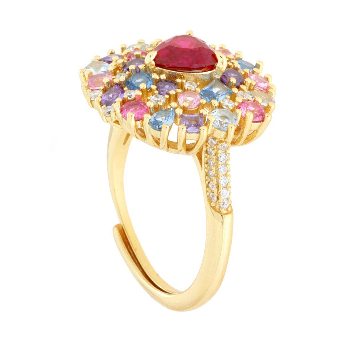 Anello in oro con pietra rossa centrale, contornata da gemme colorate e diamanti.