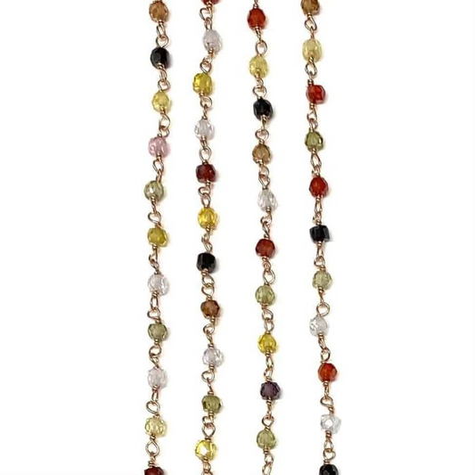 Collana d'oro con pietre preziose multicolori, incastonate singolarmente.