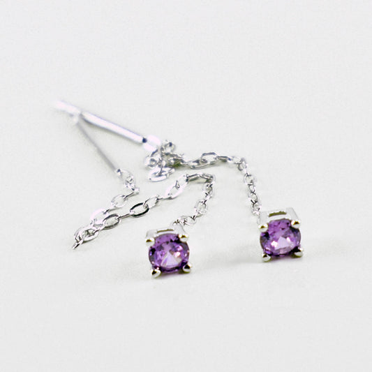 Orecchini pendenti in argento 925 con catena e punto luce con zirconia cubica viola.