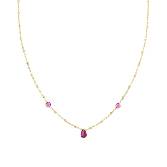 Collana in oro con catena a rosario e pendente a goccia fucsia, con due gemme rotonde.