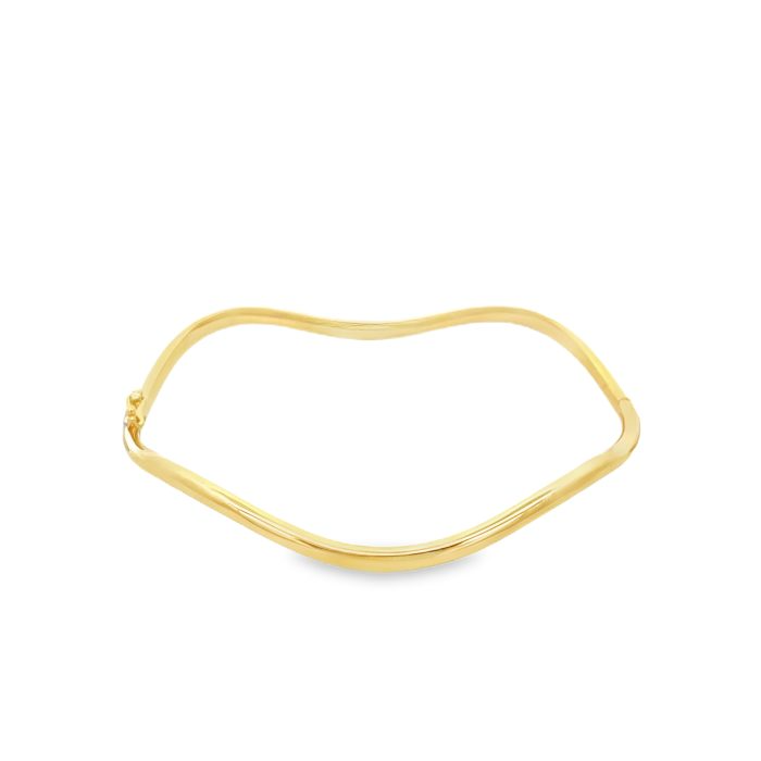 Bracciale rigido ondulato in oro giallo.