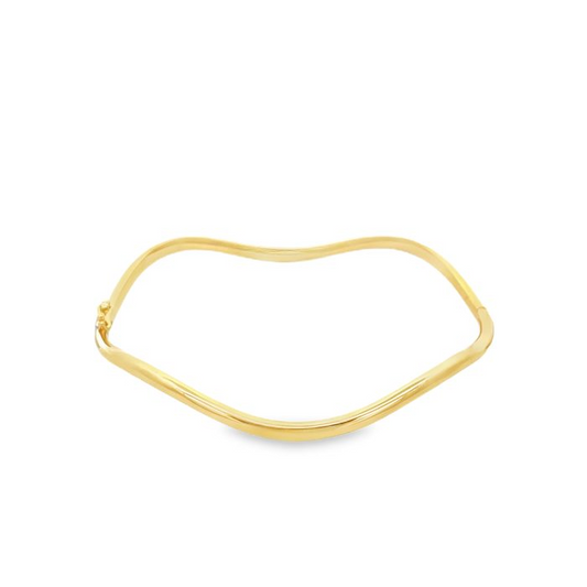 Bracciale rigido ondulato in oro giallo.