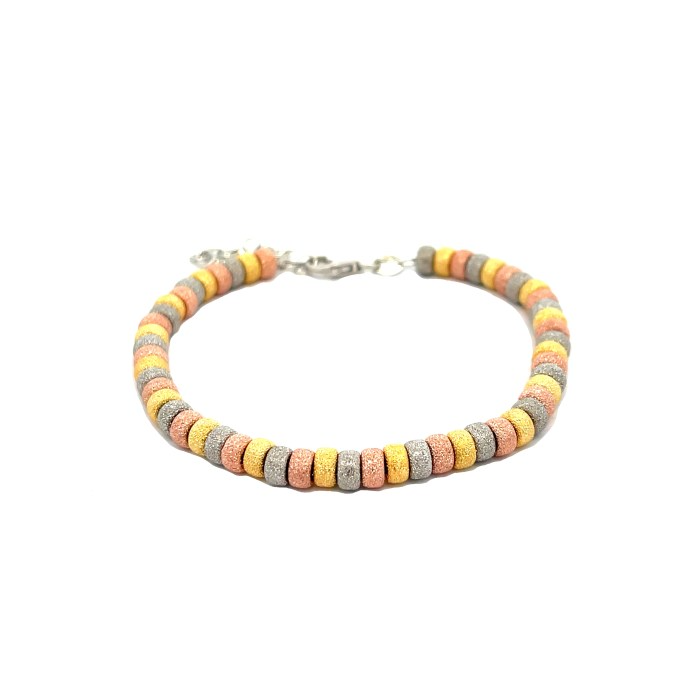 Braccialetto con rondelle di diamanti in tre colori: rosa, giallo e argento.