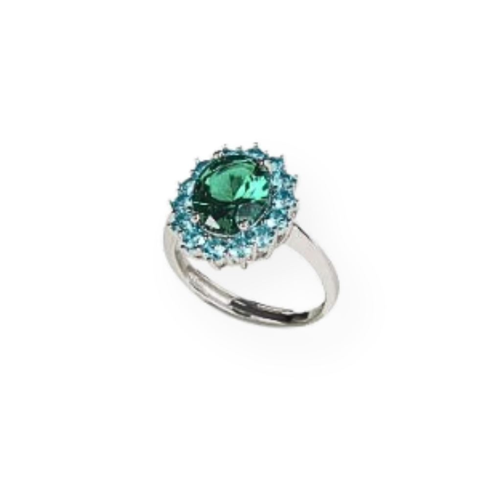 Anello in argento con grande pietra verde ovale circondata da pietre turchesi.