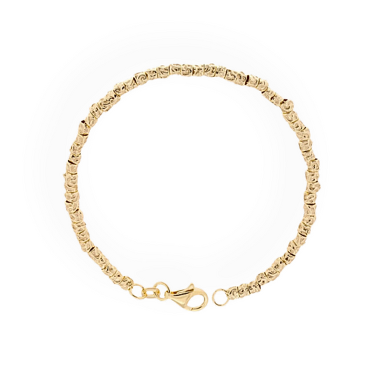Braccialetto in oro con maglia a forma di piccole sfere e chiusura a moschettone.