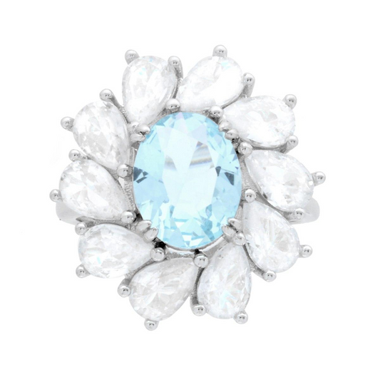 Anello in argento con una grande pietra ovale azzurra circondata da 12 pietre a goccia bianche.